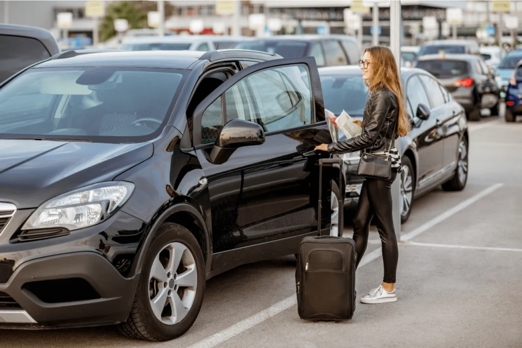 Women getting into a rental car