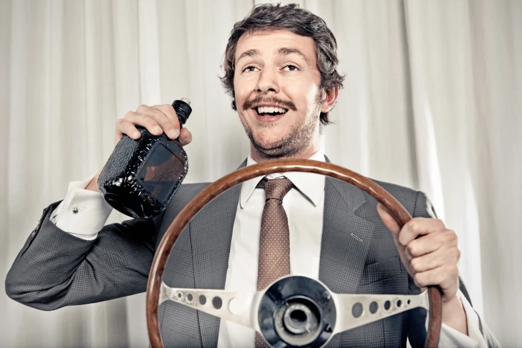 Man with a DUI Drinking and Driving