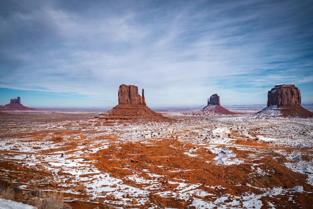 snow covering red Arizona dirt