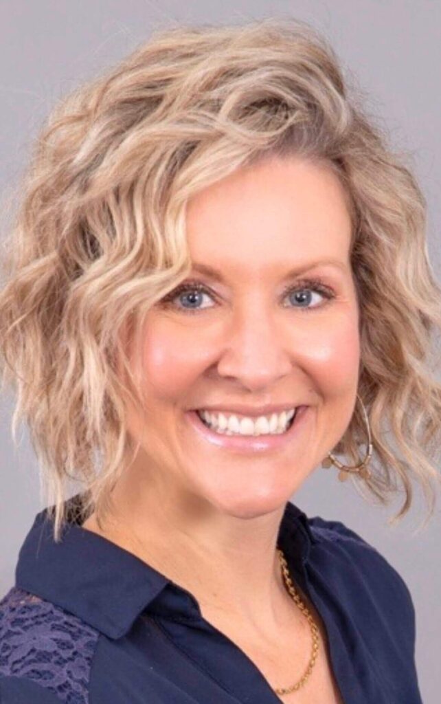 Woman Smiling with blue shirt on