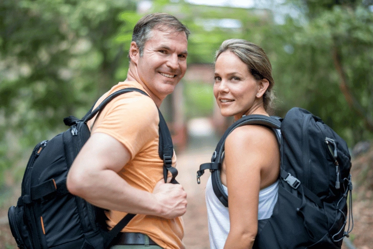 Couple hiking with large backpacks