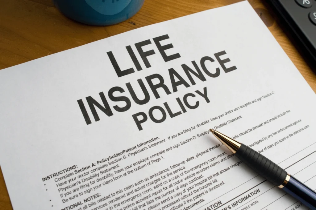 Photo of a life insurance policy and pen