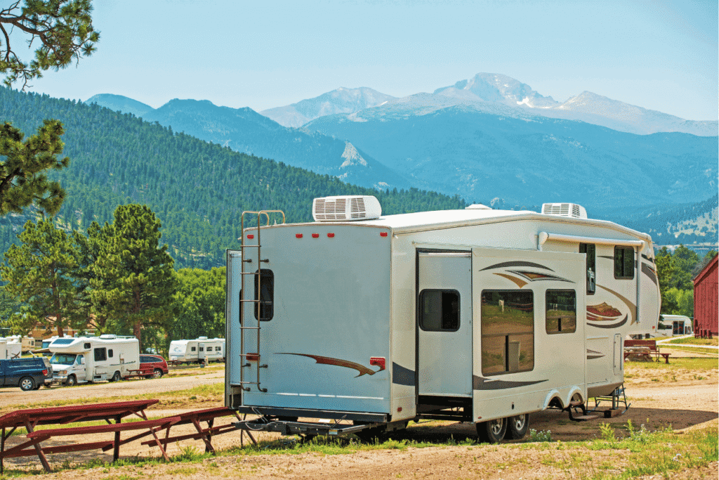 Travel trailer surrounded by beautiful mountains