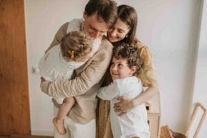 Family of 4 hugging